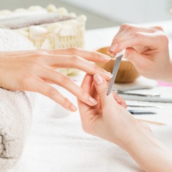 Manicure treatment at nail salon