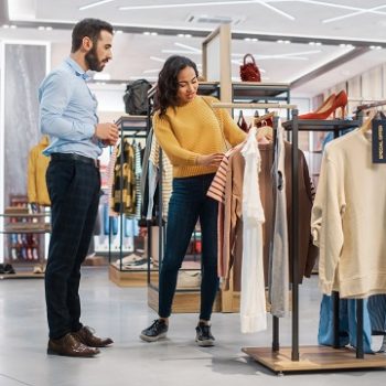 Young Female Customer Shopping in Clothing Store, Retail Sales A
