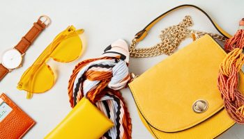 Flat lay with woman fashion accessories in yellow colors. Fashion blog, summer style, shopping and trends idea
